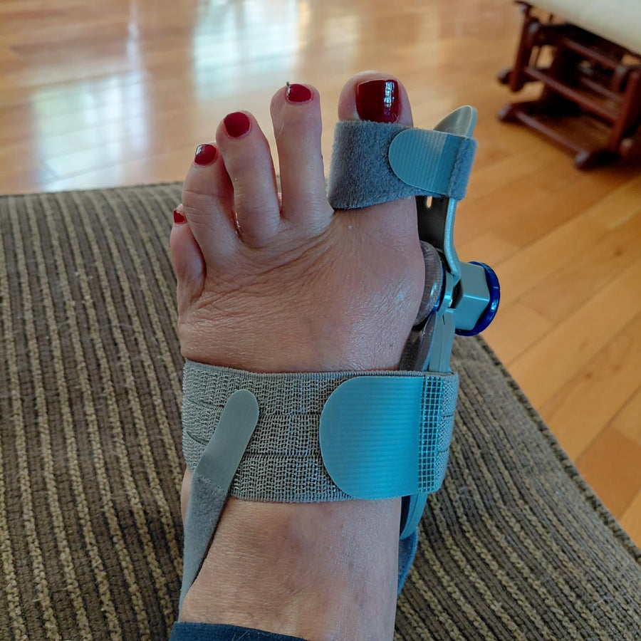 Customer using the night splint sock before bed
