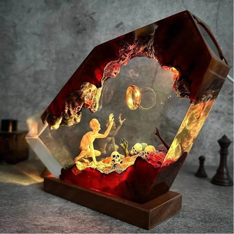 Side view of gaunt figure reaching toward a ring in ember-lit resin showing clear sculptural depth and illuminated detail