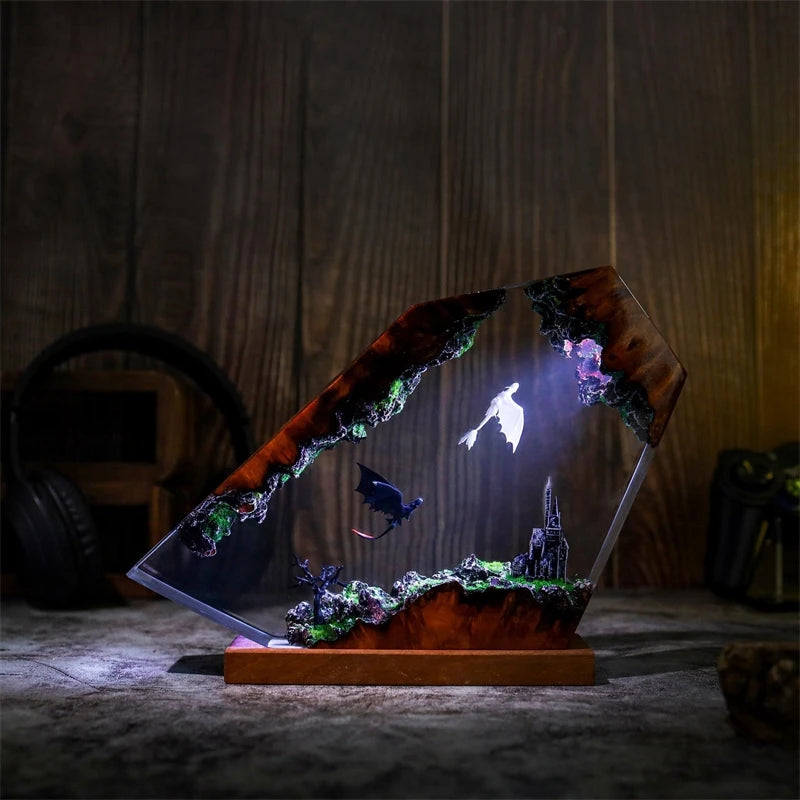 Nocturne Flight, pale birds crossing above a distant spire in clear resin, illuminated in cool violet and blue light