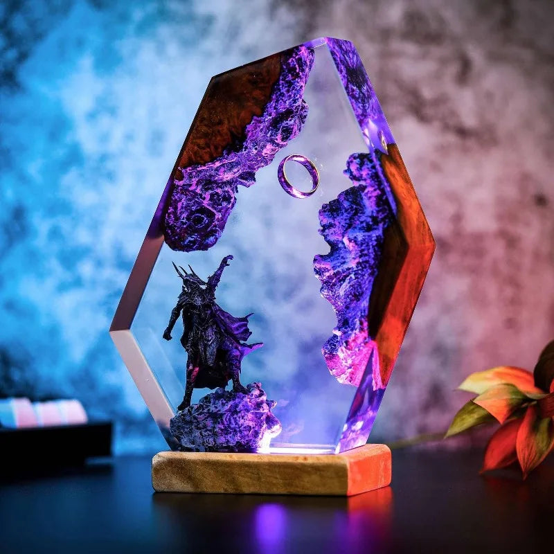 Close view of armored shadow sovereign beneath a suspended ring in resin with hand-finished texture and violet, white, and amber light