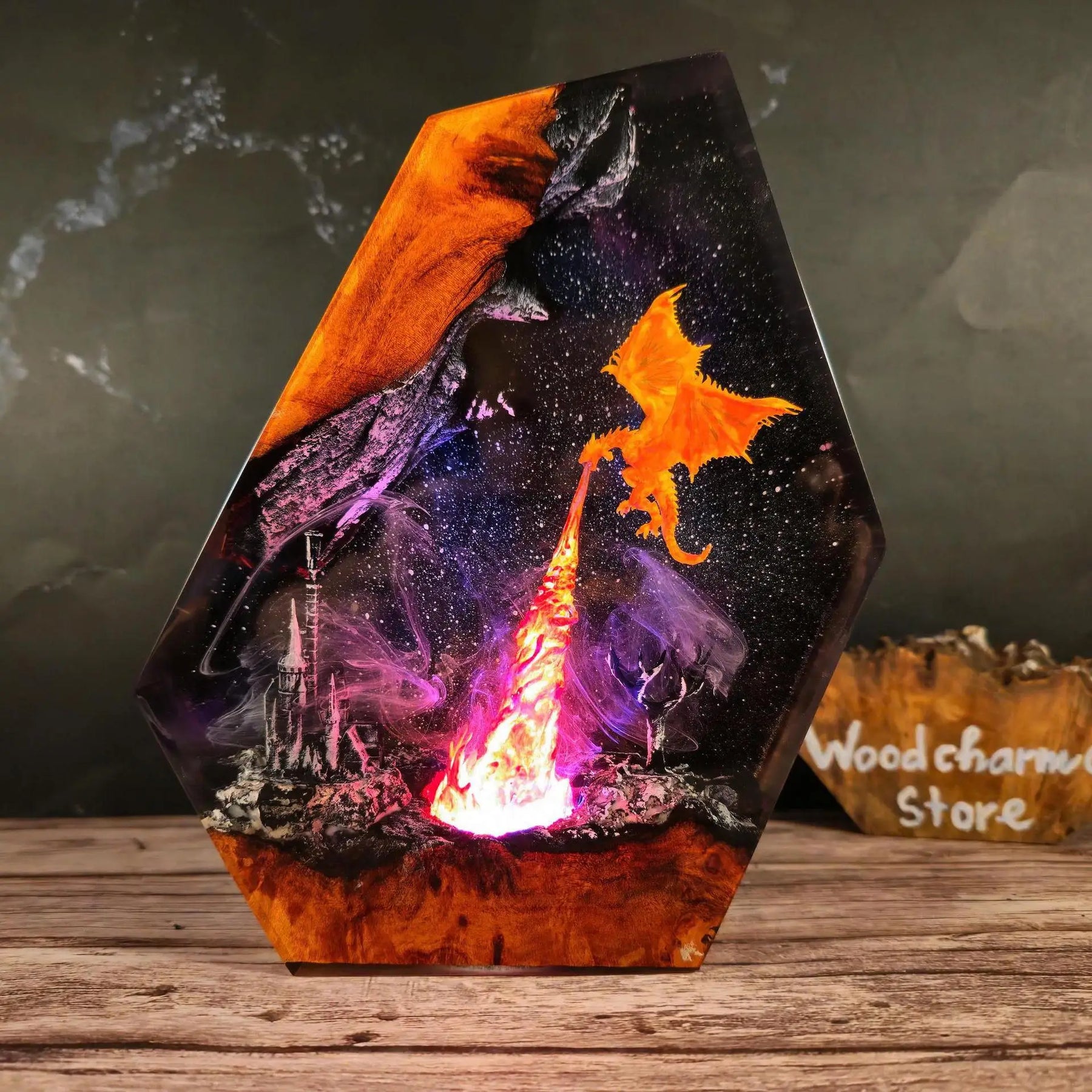 Citadel Ember, fire dragon circling a burning citadel inside resin, illuminated in molten orange and violet light